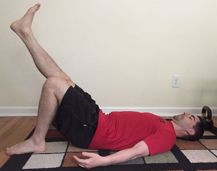 Ryan Jankowitz Back pressure crunch with leg raise