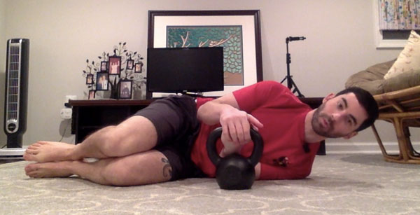 Ryan Jankowitz kettlebell-Get-Up beginning at fetal position