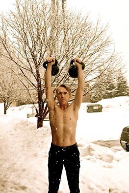 John Du Cane with kettlebells in the snow