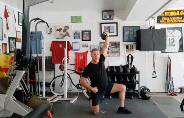 Dan John Demonstrates part of the Get-Down Press Sequence with a light kettlebell